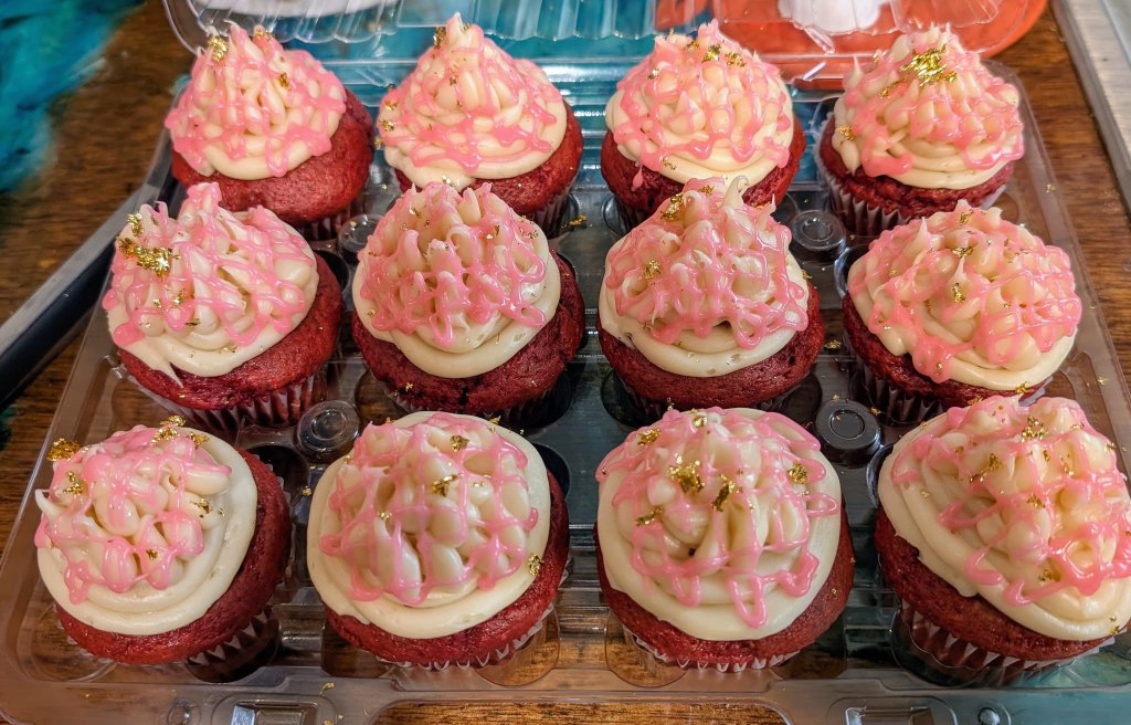 That One Place, LLC | Red Velvet Cupcakes with Cream Cheese Frosting & Gold Flakes
